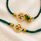 Emerald green Kundan rakhi set for bhai and bhabhi with pearl and gold bead detailing