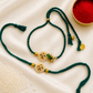 Emerald green Kundan rakhi set for bhai and bhabhi with pearl and gold bead detailing